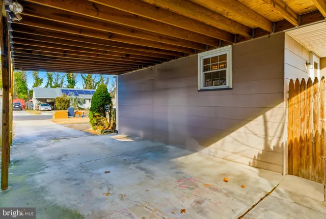 a view of backyard with a table and chairs