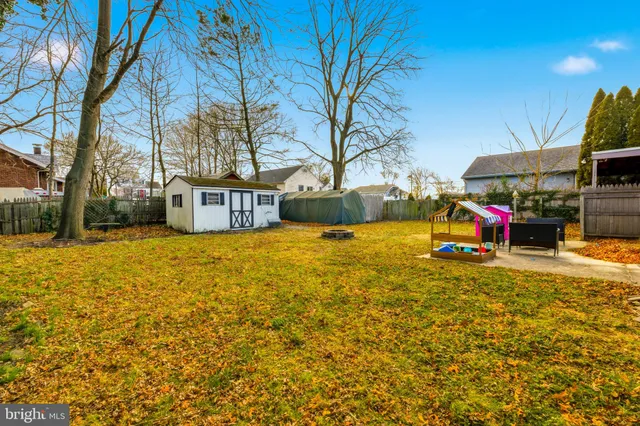 a view of a swimming pool with an outdoor space and seating area