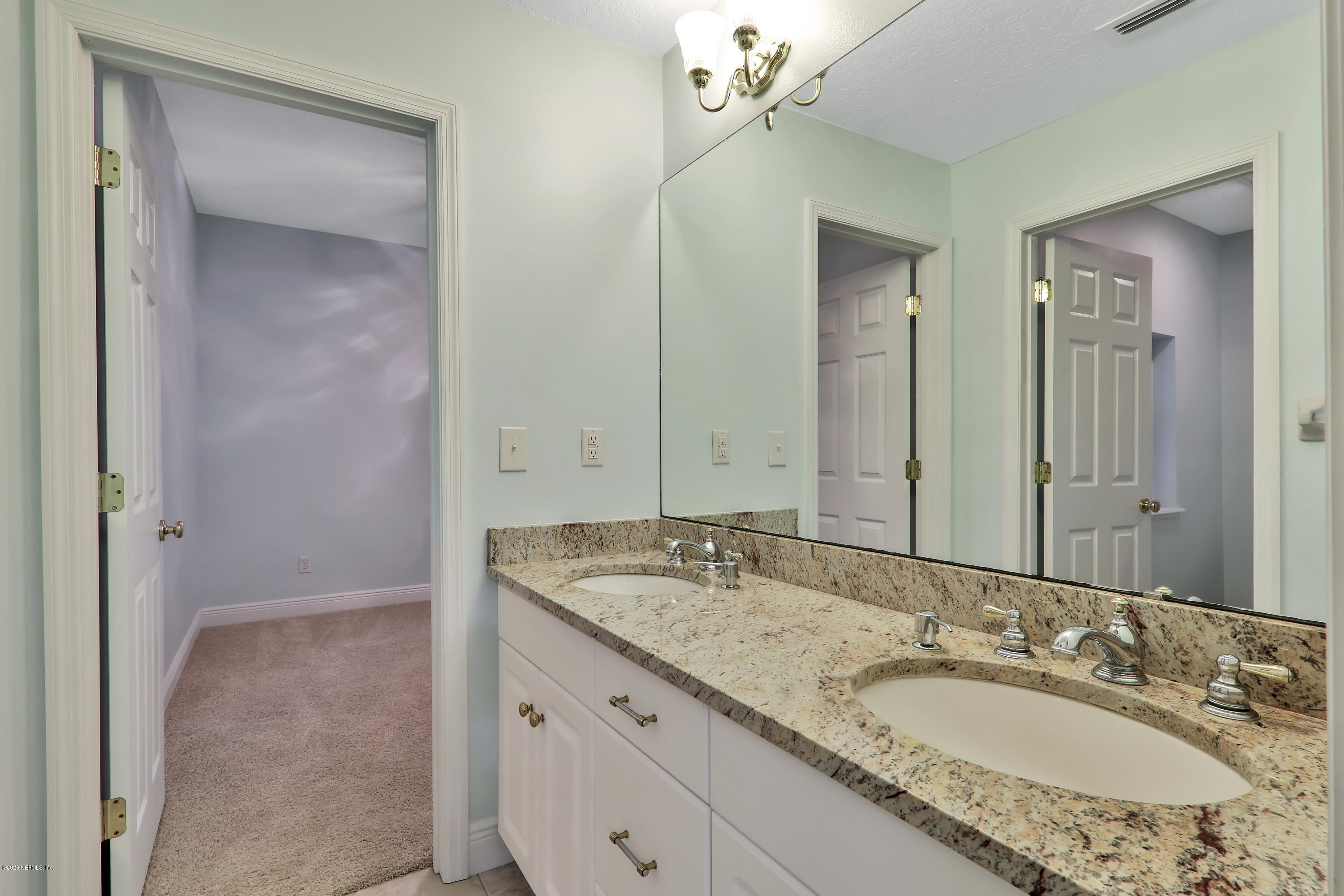 3289 Kings Road South St. Augustine, FL 32086 - Photo 16 of 41 a bathroom with a granite countertop sink and a mirror