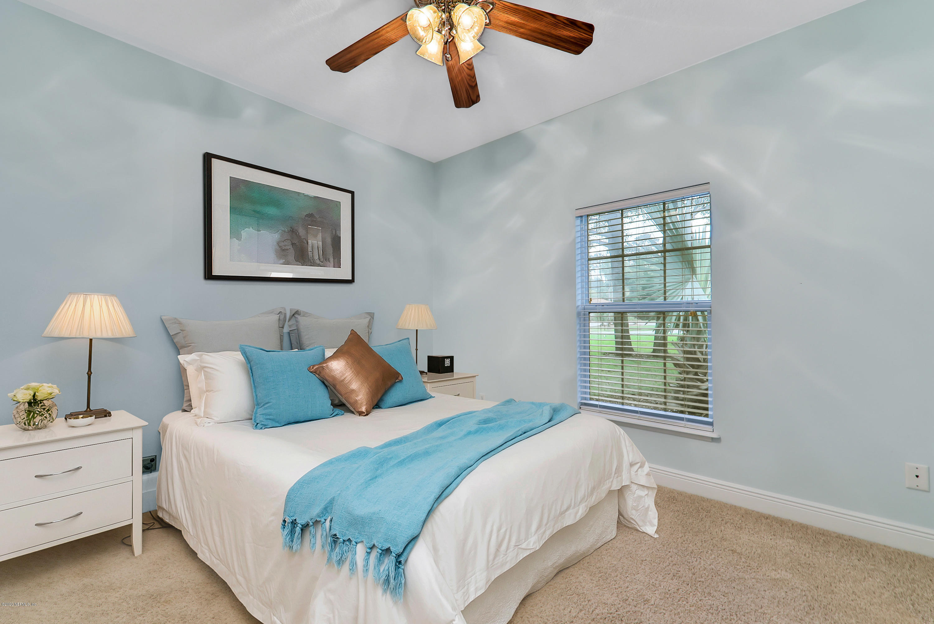 3289 Kings Road South St. Augustine, FL 32086 - Photo 19 of 41 a bedroom with a bed and a window