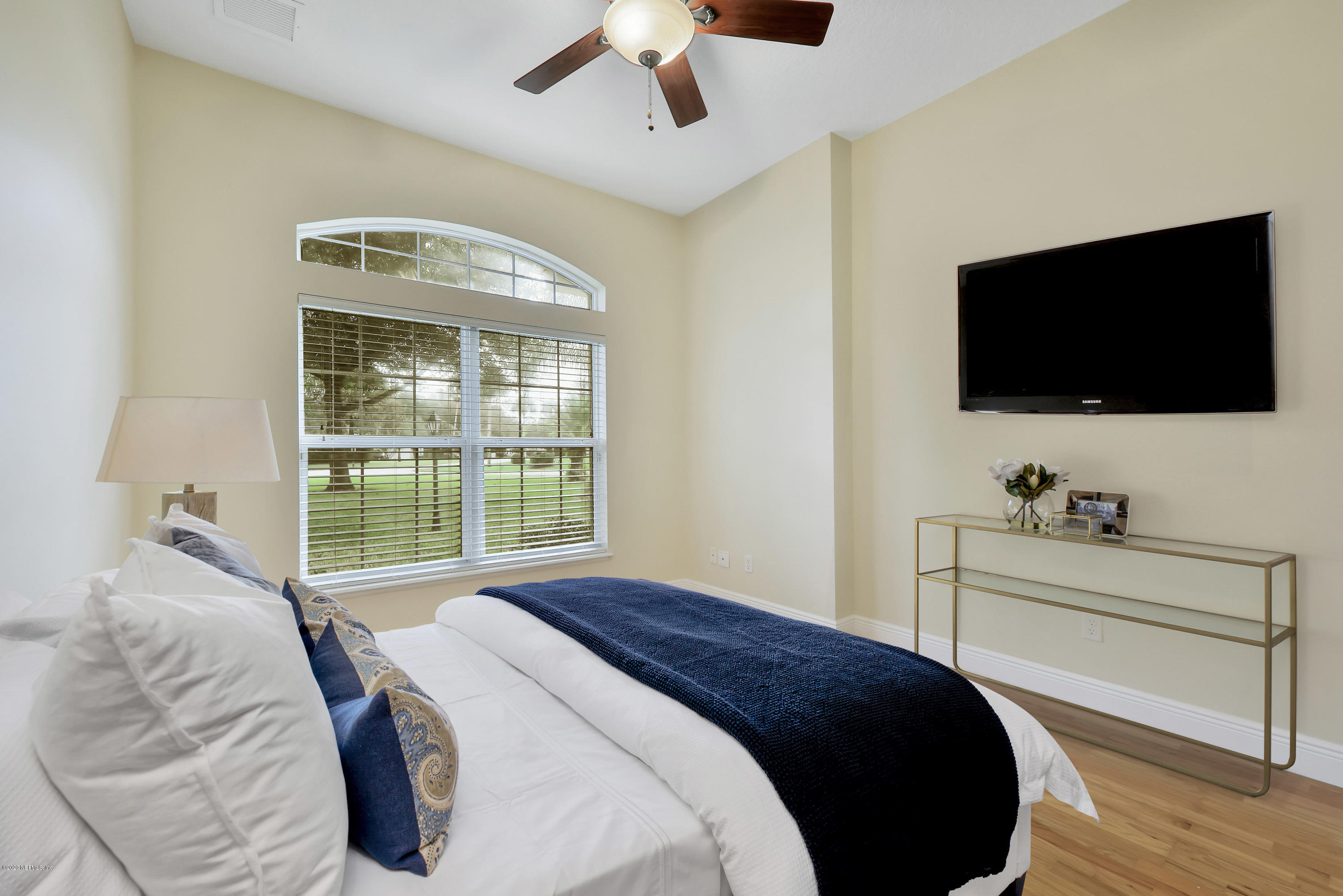 3289 Kings Road South St. Augustine, FL 32086 - Photo 20 of 41 a bedroom with a bed and a flat screen tv