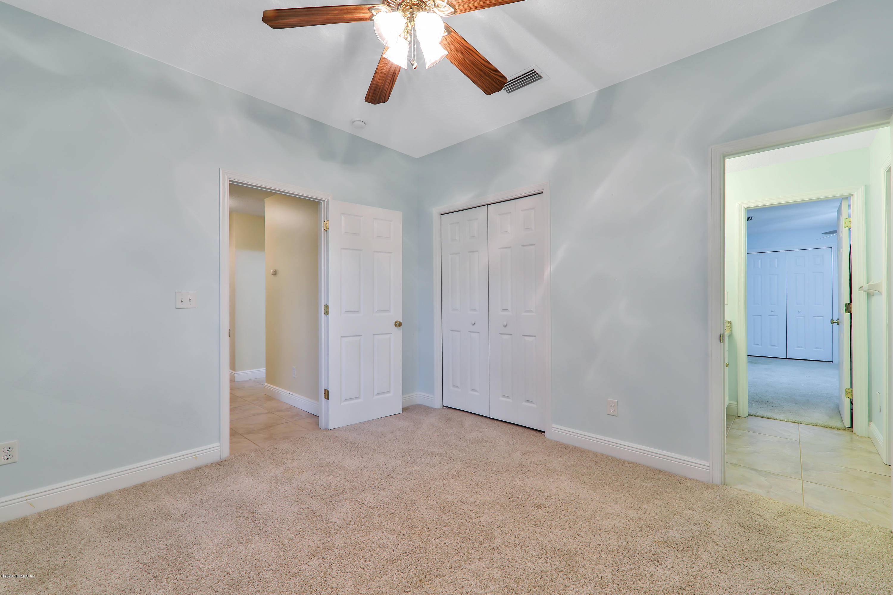 3289 Kings Road South St. Augustine, FL 32086 - Photo 23 of 41 an empty room with chandelier fan and closet