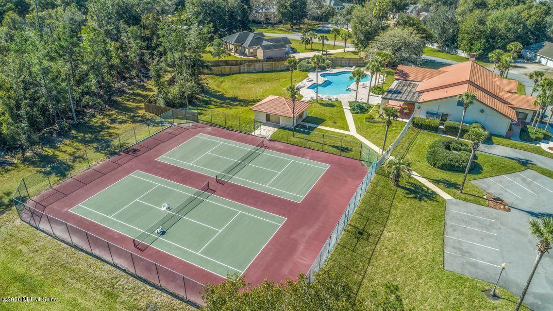 3289 Kings Road South St. Augustine, FL 32086 - Photo 26 of 41 an aerial view of a tennis ground with a white house