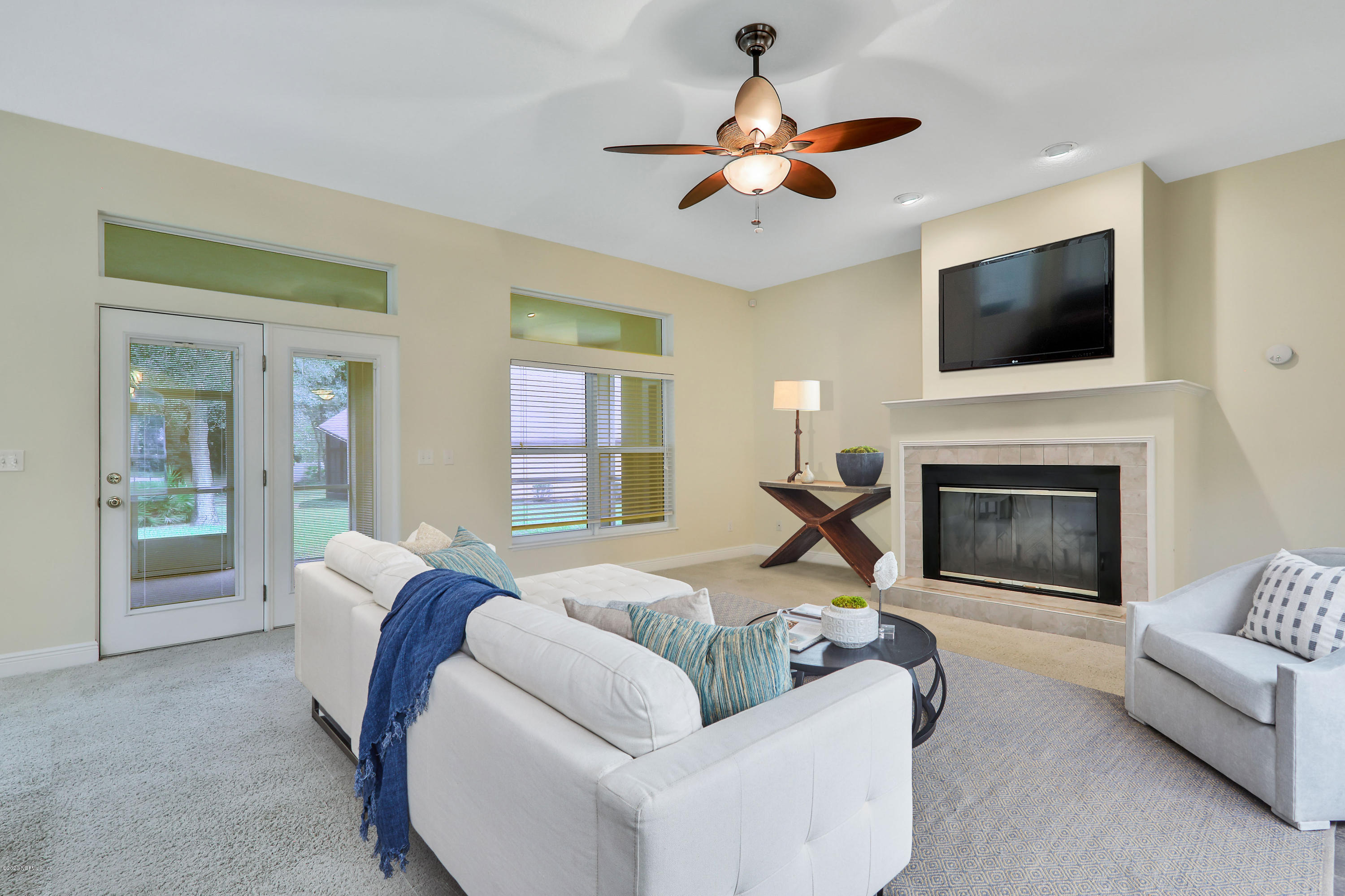 3289 Kings Road South St. Augustine, FL 32086 - Photo 3 of 41 a living room with furniture fireplace and flat screen tv