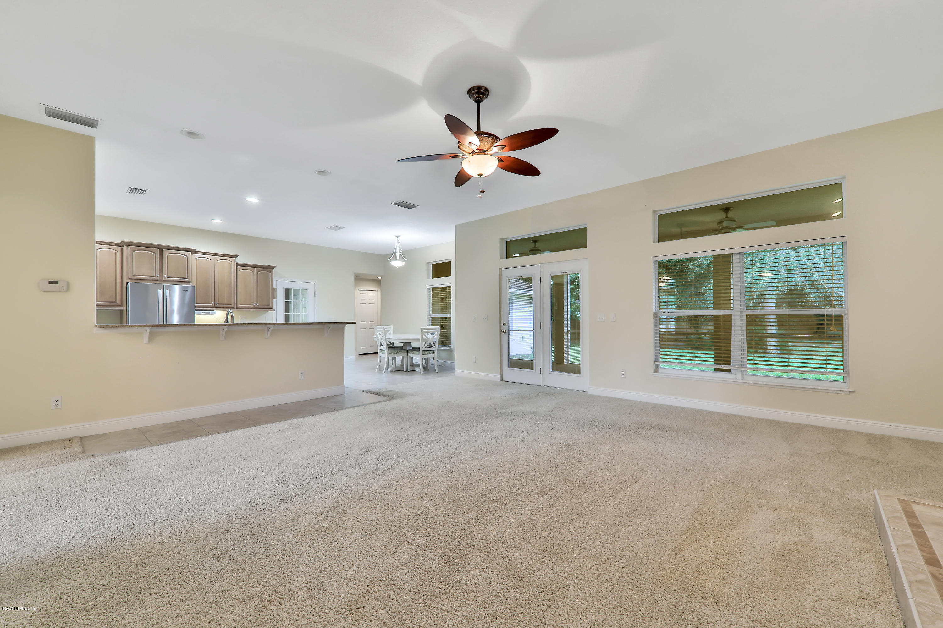 3289 Kings Road South St. Augustine, FL 32086 - Photo 31 of 41 a view of a livingroom with a ceiling fan and window
