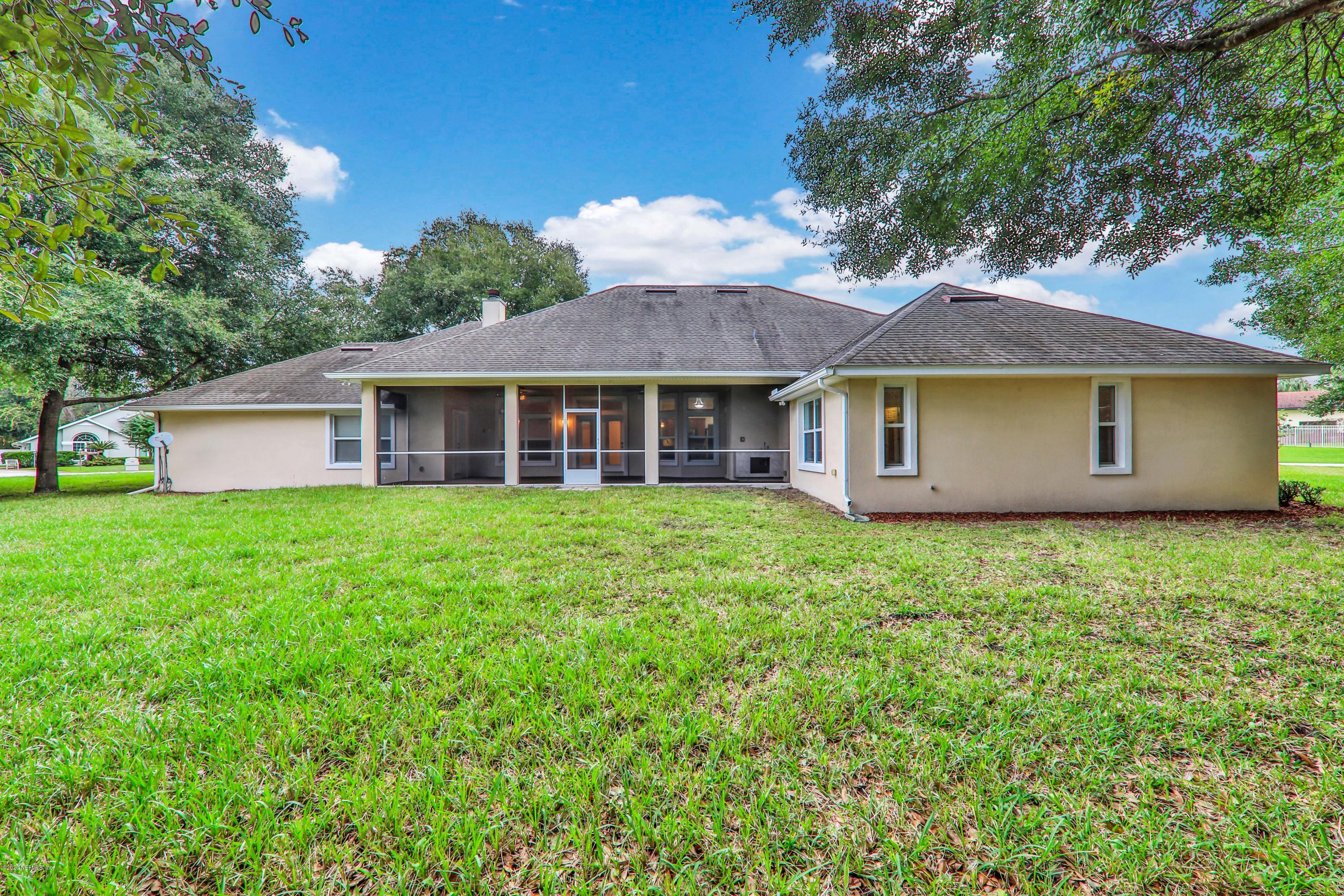 3289 Kings Road South St. Augustine, FL 32086 - Photo 36 of 41 a view of a house with a yard and sitting area