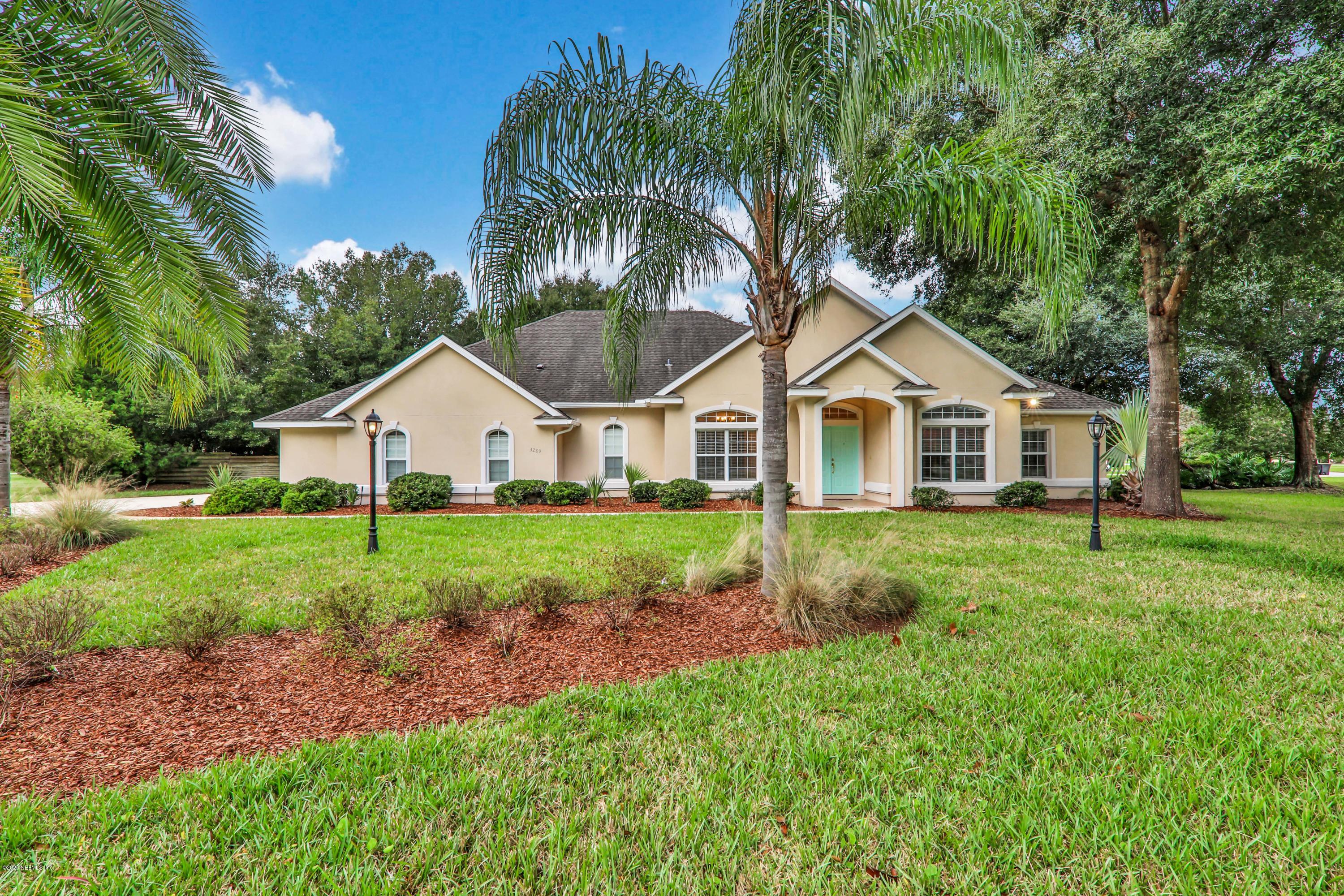 3289 Kings Road South St. Augustine, FL 32086 - Photo 39 of 41 a view of a house with backyard and garden