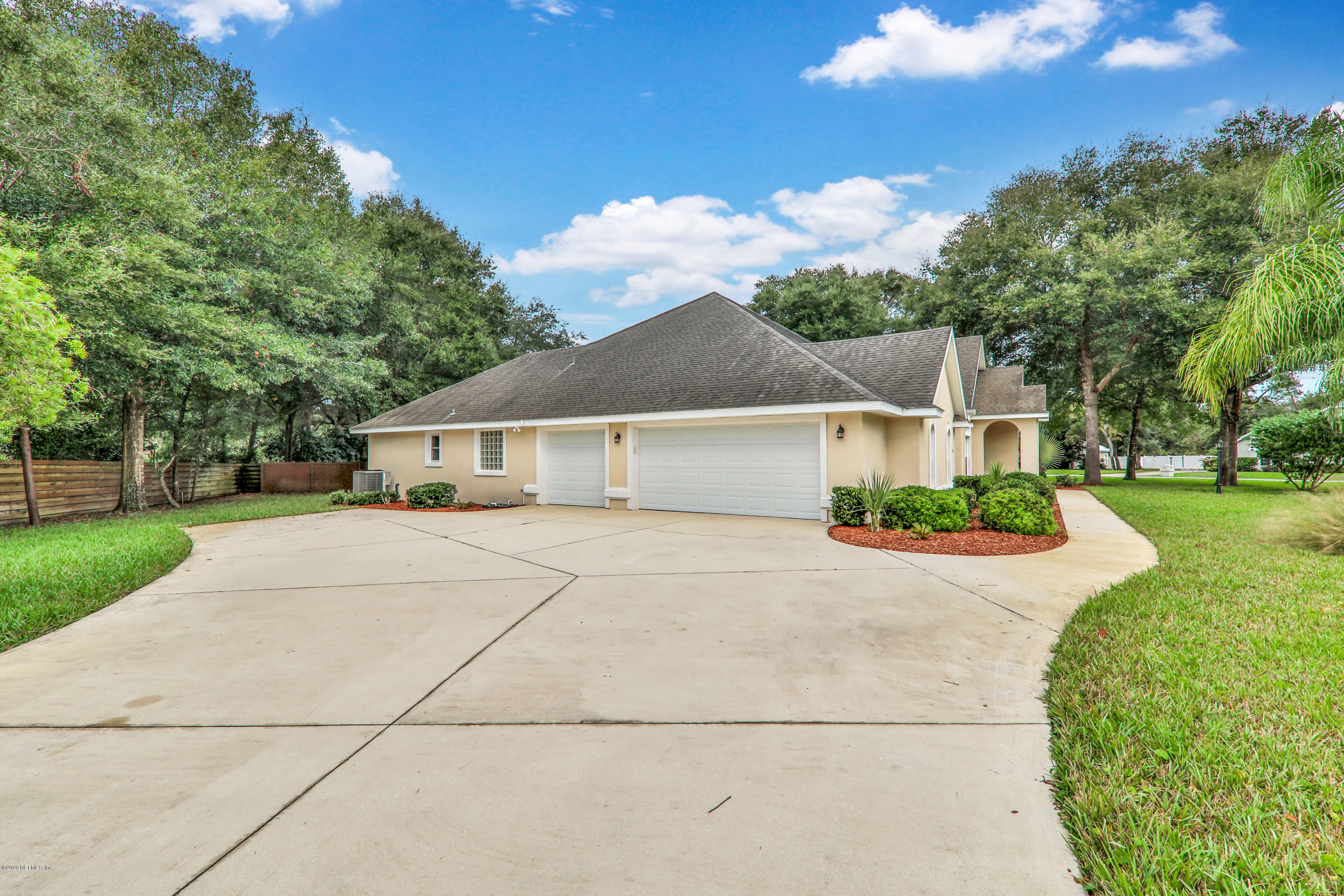 3289 Kings Road South St. Augustine, FL 32086 - Photo 41 of 41 a front view of a house with a yard and trees