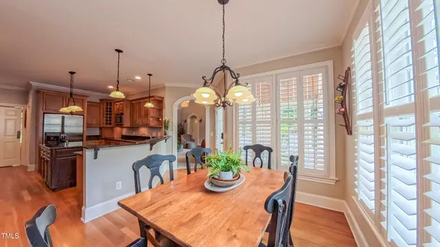 a kitchen with stainless steel appliances granite countertop a stove and cabinets