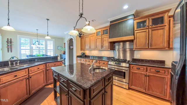 a view of a dinning table and chairs in patio of the house
