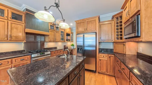 a view of a patio with a dining table and chairs