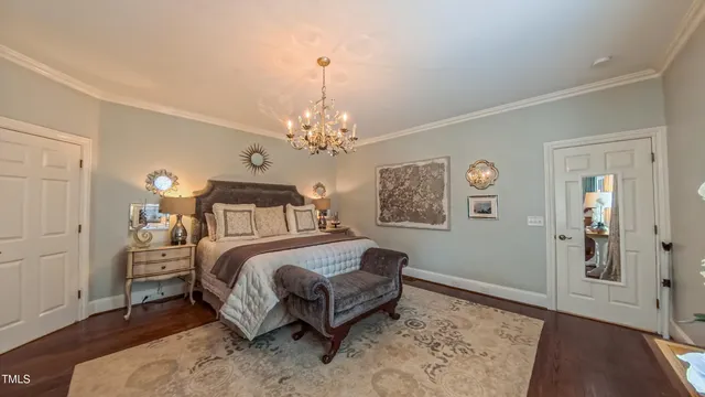 a living room with fireplace furniture and a wooden floor