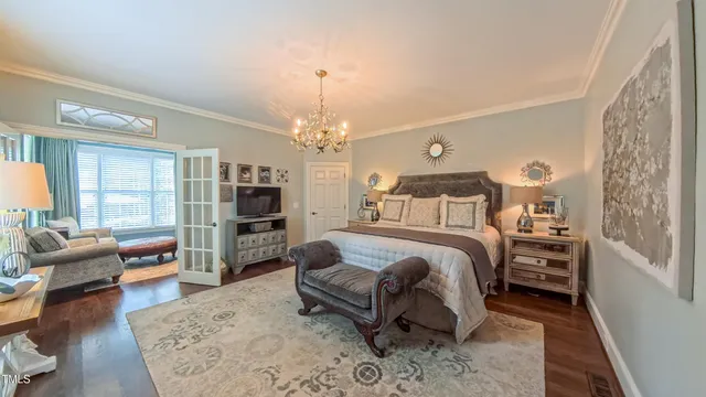 a large kitchen with stainless steel appliances a large counter top a stove and a sink