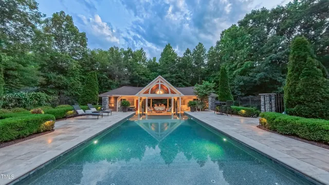 a backyard of a house with yard and outdoor seating