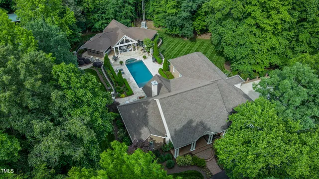 a living room with furniture a fireplace and a large window