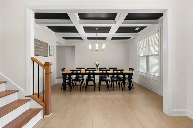 a kitchen with stainless steel appliances granite countertop a sink a stove a refrigerator and cabinets