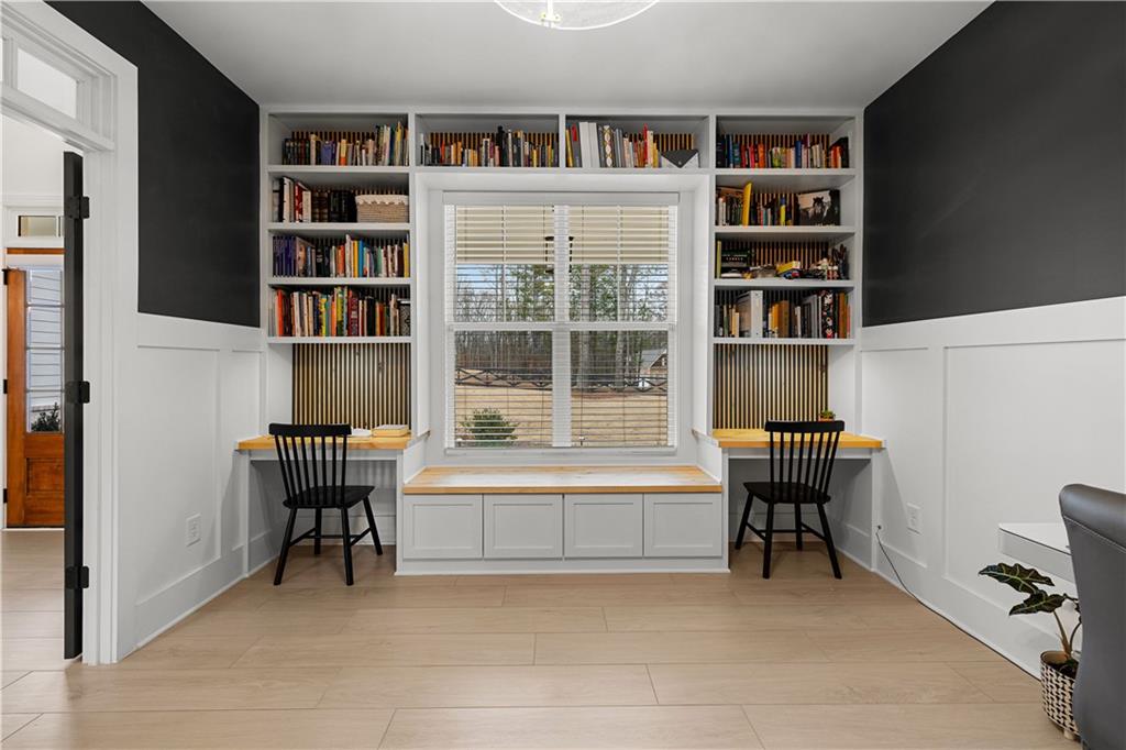 4895 Cool Springs Road Winston, GA 30187 - Photo 19 of 85 a view of a workspace with bookshelf and a window