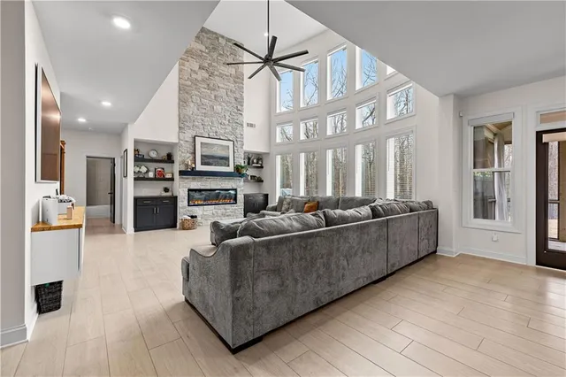 a living room with furniture and a fireplace