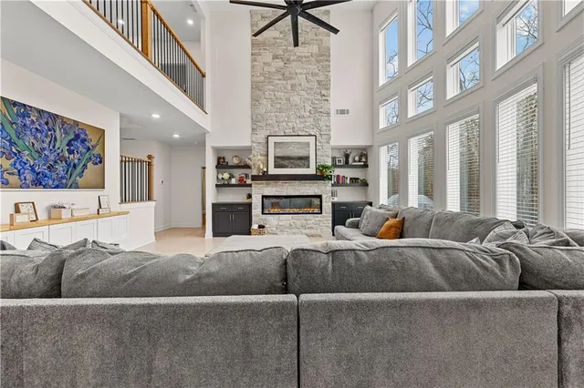 a bathroom with a granite countertop sink toilet and a mirror