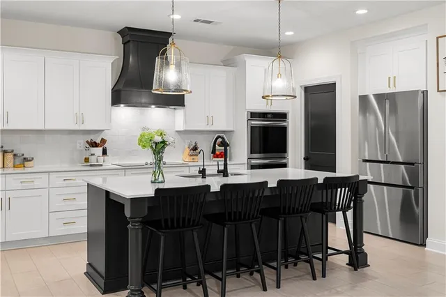 a bathroom with a granite countertop sink a toilet and shower