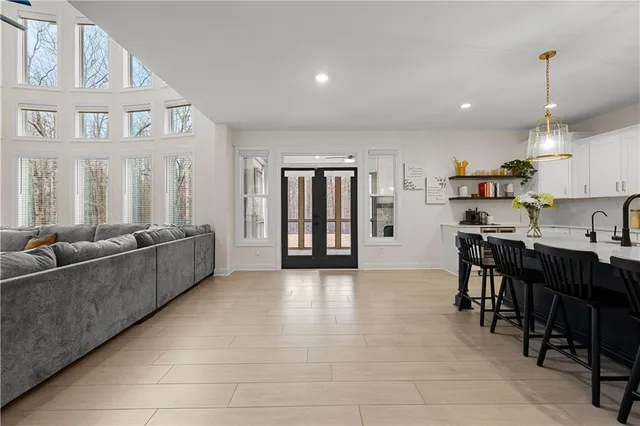 a spacious bedroom with a bed and a walk in closet