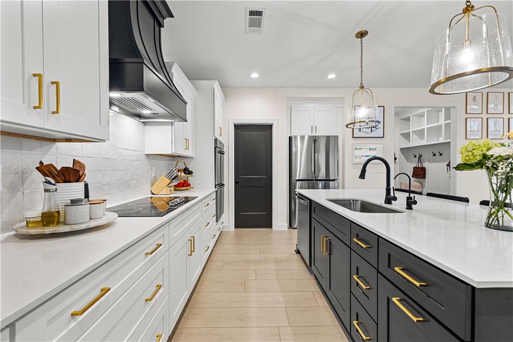 4895 Cool Springs Road Winston, GA 30187 - Photo 30 of 85 a kitchen with stainless steel appliances a sink stove and cabinets