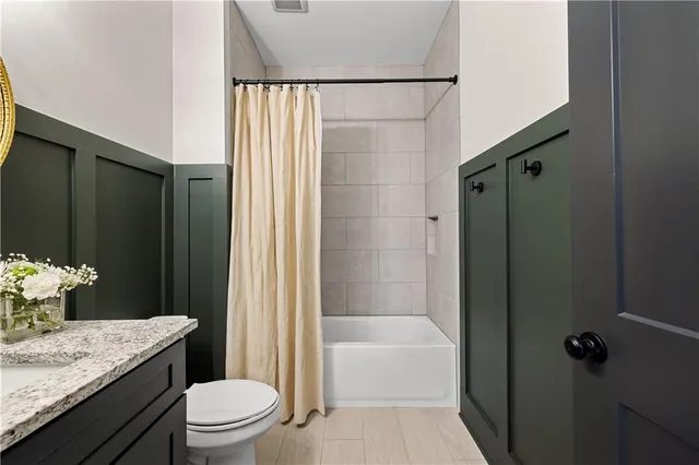 a bedroom with furniture and a baby crib