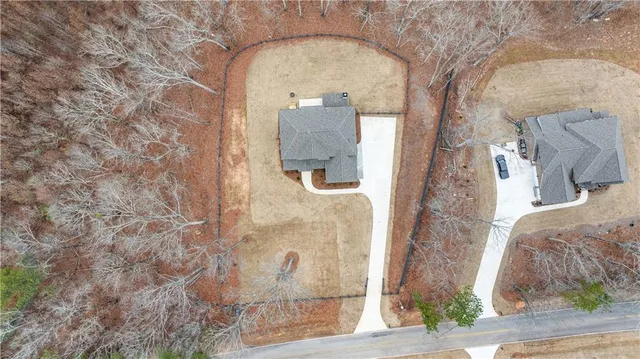 a view of house with a yard covered with snow