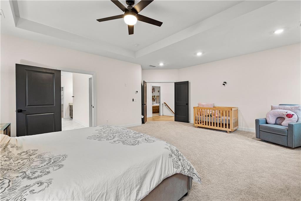 4895 Cool Springs Road Winston, GA 30187 - Photo 42 of 85 a spacious bedroom with a bed and a walk in closet