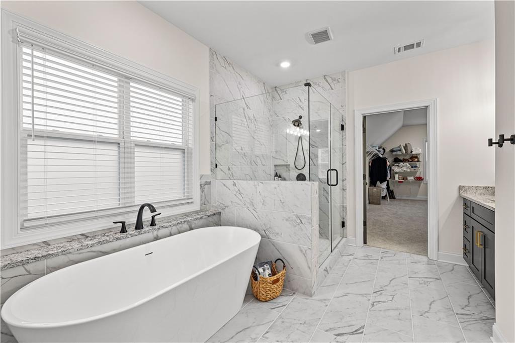 4895 Cool Springs Road Winston, GA 30187 - Photo 44 of 85 a spacious bathroom with a tub sink and mirror