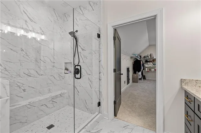 a view of a livingroom with an empty space and a fireplace