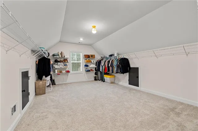 a view of a yard with wooden fence