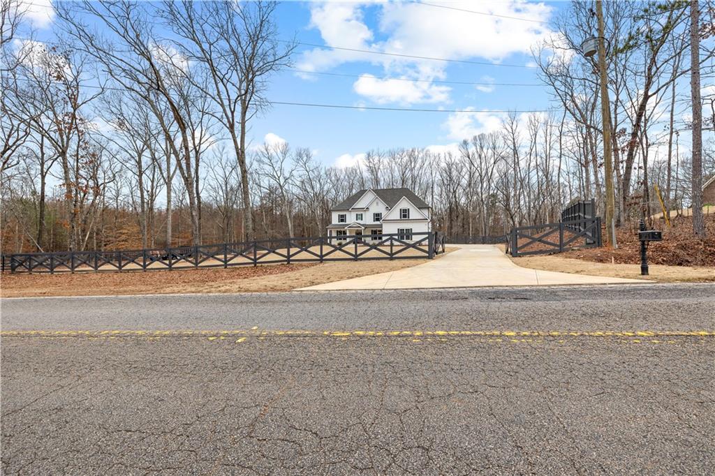 4895 Cool Springs Road Winston, GA 30187 - Photo 5 of 85 a view of the house with snow on the road