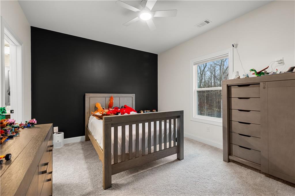 4895 Cool Springs Road Winston, GA 30187 - Photo 58 of 85 a bedroom with furniture and a baby crib
