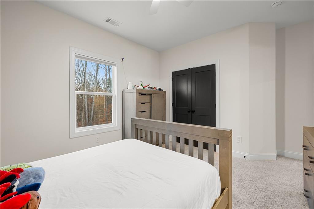 4895 Cool Springs Road Winston, GA 30187 - Photo 59 of 85 a bed sitting in a bedroom next to a window