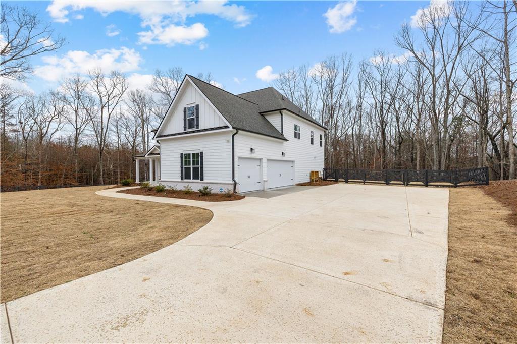 4895 Cool Springs Road Winston, GA 30187 - Photo 6 of 85 a view of house with a yard covered with snow