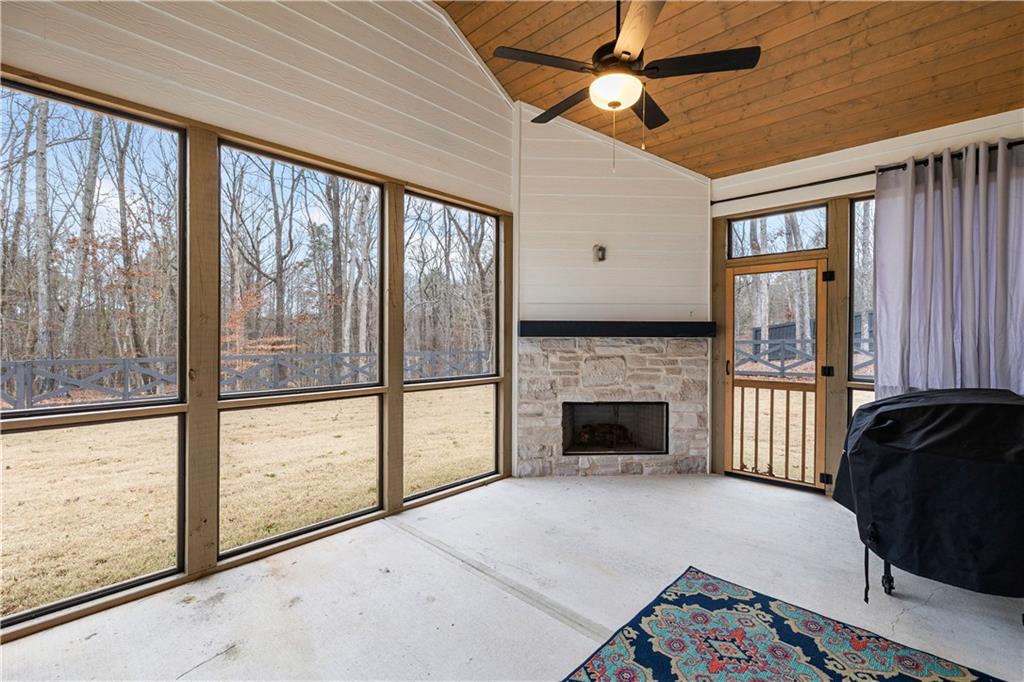 4895 Cool Springs Road Winston, GA 30187 - Photo 73 of 85 a living room with a fireplace furniture and a large window