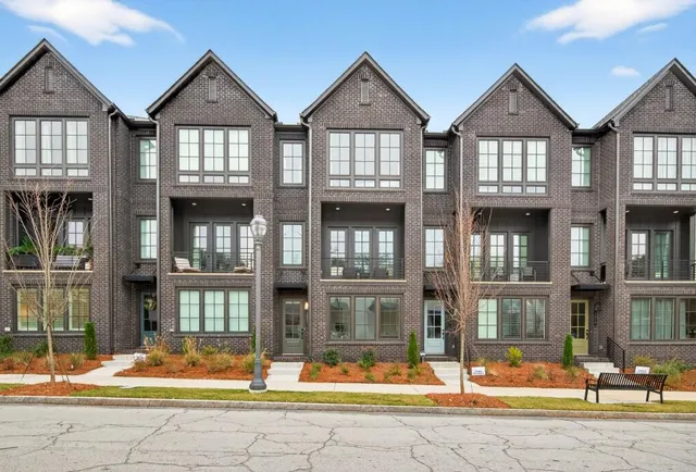 front view of a brick house with a outdoor view