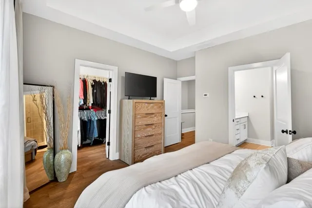 a bedroom with a bed and a television