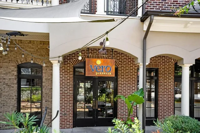 a view of a brick building with many windows