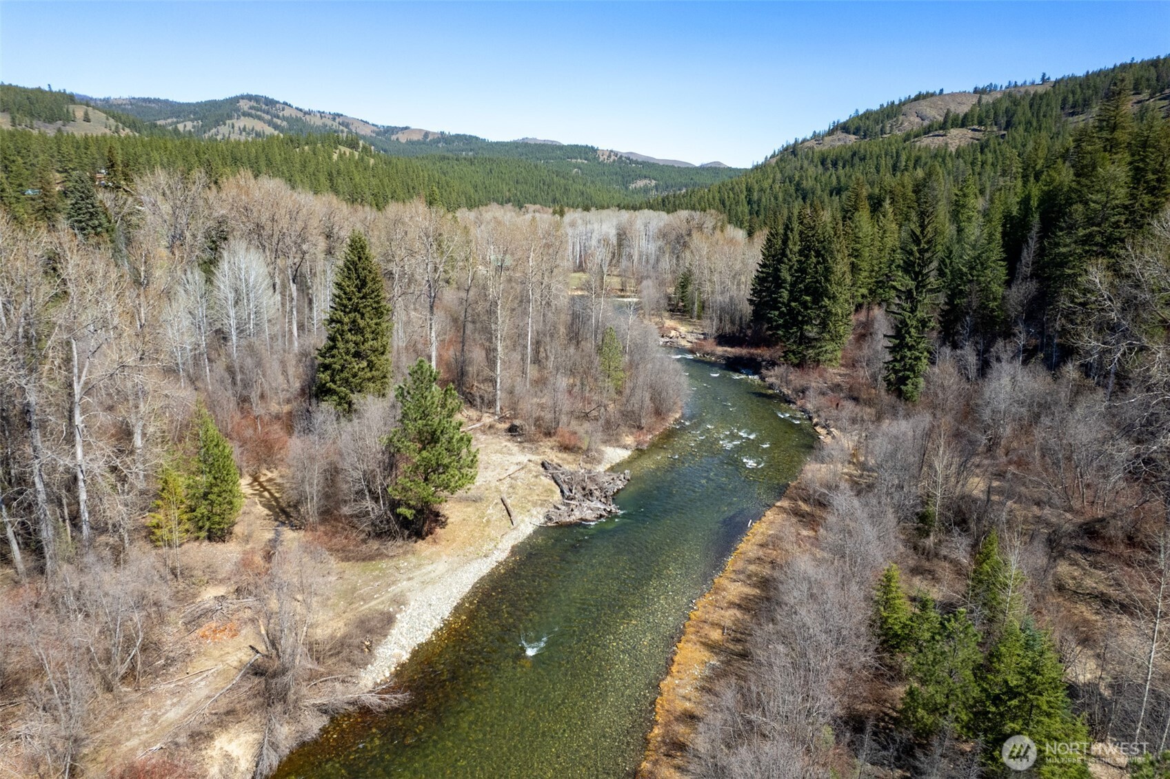 929 A Twisp River Road Twisp, WA 98856 - Photo 16 of 19 a view of a lake with a mountain in the background