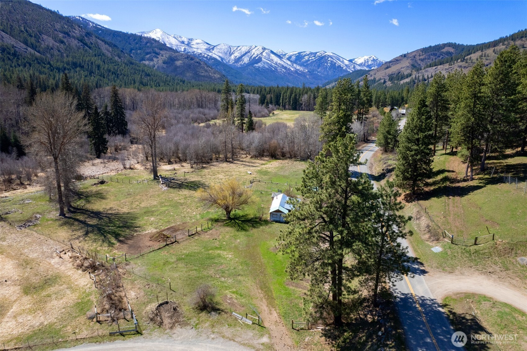 929 A Twisp River Road Twisp, WA 98856 - Photo 3 of 19 a view of a backyard with a garden