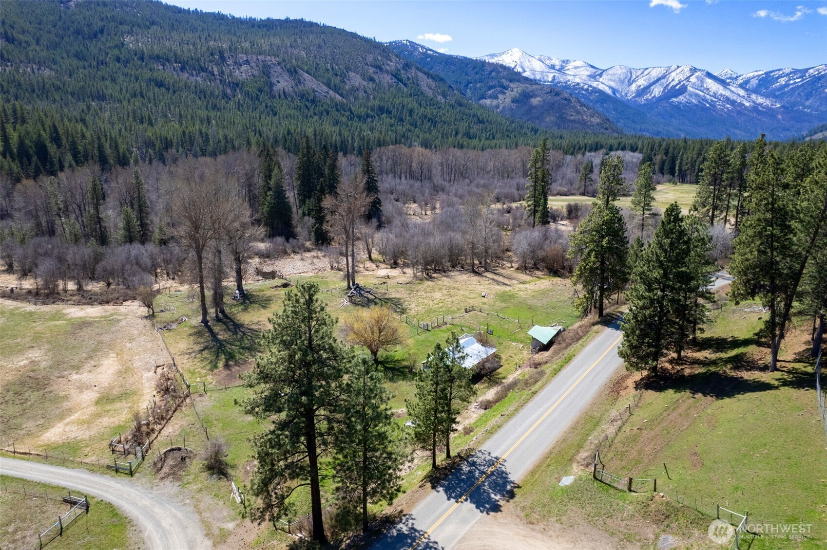 929 A Twisp River Road Twisp, WA 98856 - Photo 5 of 19 a view of a backyard with tv
