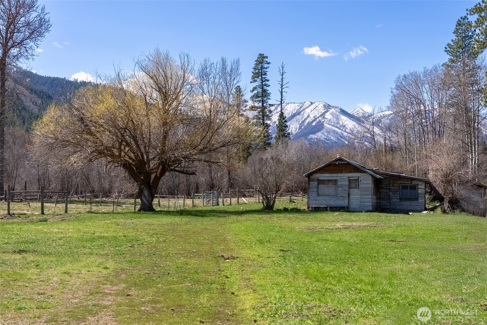 929 A Twisp River Road Twisp, WA 98856 - Photo 8 of 19 a view of a house with a big yard