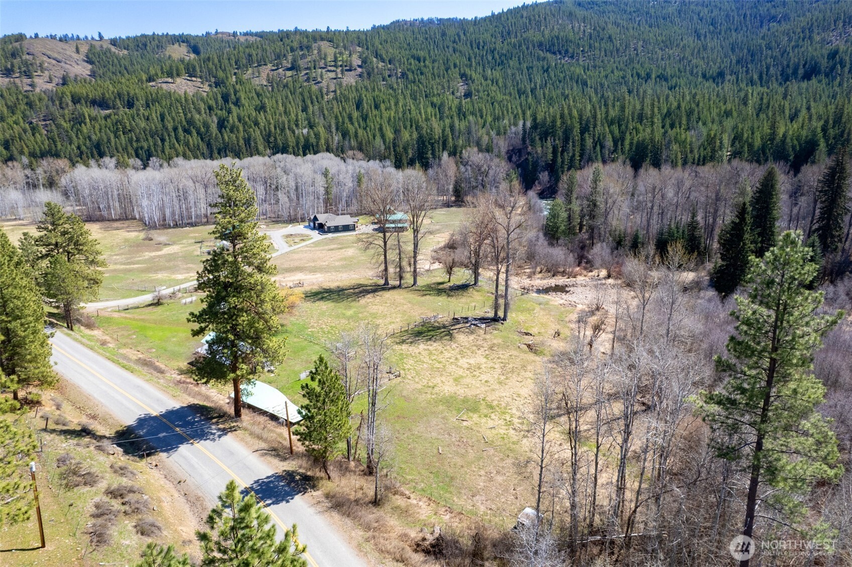929 A Twisp River Road Twisp, WA 98856 - Photo 10 of 19 a view of a back yard of a house
