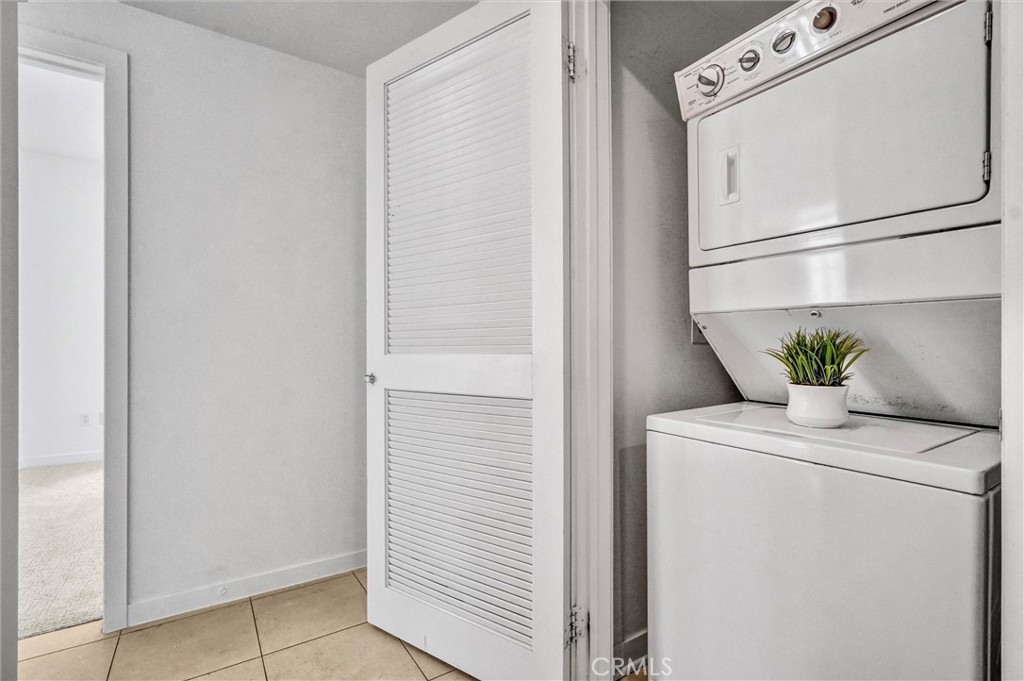 411 West Seaside Way, Unit 1804 Long Beach, CA 90802 - Photo 18 of 55 a white refrigerator freezer sitting inside of a kitchen
