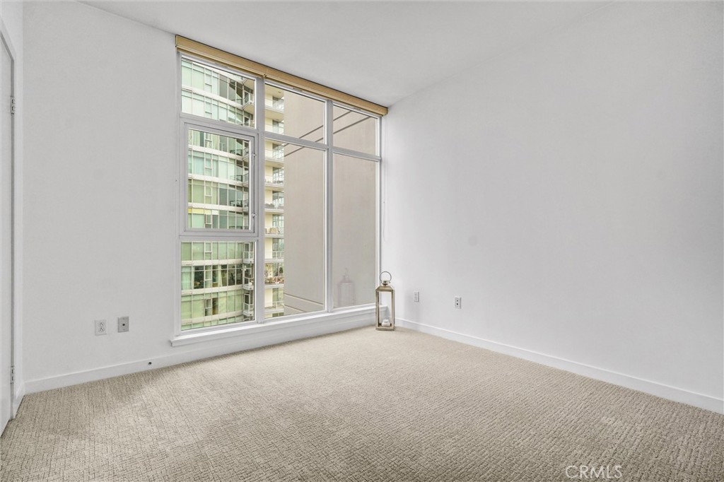 411 West Seaside Way, Unit 1804 Long Beach, CA 90802 - Photo 19 of 55 an empty room with a empty space and windows
