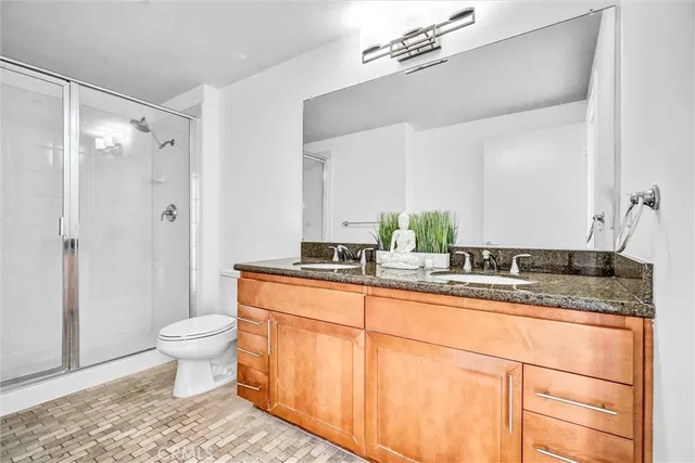 a bedroom with a large bed and a large window