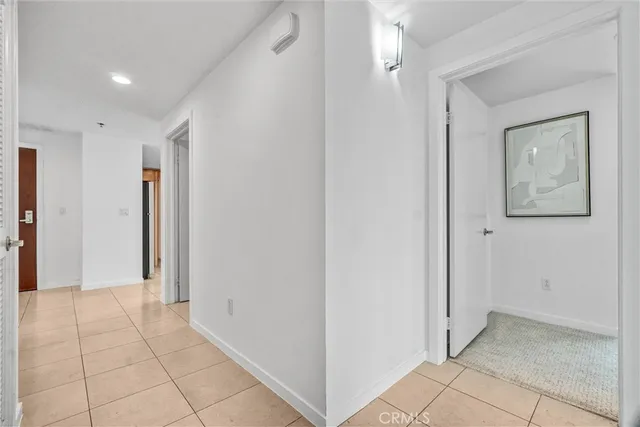 a view of a dining room with furniture large windows and wooden floor
