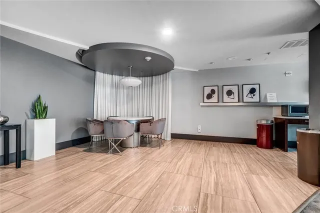 a view of a swimming pool with outdoor seating